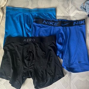 1 blue Calvin Klein, 1 black aero, and 1 blue Nike boxerbrief size large